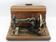 G H LEE & CO LTD LIVERPOOL 'The Lee' hand crank sewing machine in walnut case
