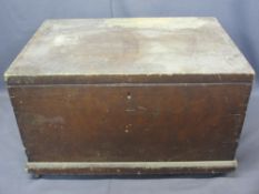 ANTIQUE PINE LIDDED CAPTAIN'S STYLE CHEST - with iron carry handles on a plinth base with metal