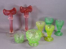 CRANBERRY GLASS VASES, A PAIR with pontil marks, 25.5cms tall and a quantity of Vaseline glass