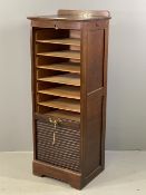 TAMBOUR FRONT FILING CABINET with nine sliding insert trays and railback to the top, keys