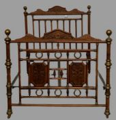 EARLY 20th CENTURY FRENCH 4ft 6ins BEDSTEAD in turned and carved wood with brass embellishments,