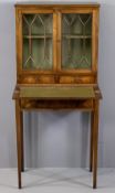 REPRODUCTION MAHOGANY LADY'S DESK with twin upper glazed doors and shelved interior over two small