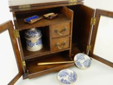 EDWARDIAN OAK SMOKER'S CABINET, fitted drawers and compartments with printed pottery tobacco jar,