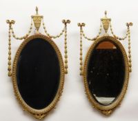 PAIR VICTORIAN NEOCLASSICAL-STYLE GILT GESSO WALL MIRRORS, tops with urns suspending ribbon-tied