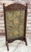 ARTS & CRAFTS EMBOSSED BRASS & OAK FIRE SCREEN, decorated with vase of flowers, foliate carved