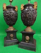 PAIR OF GILT METAL & BRONZE TWIN-HANDLED URNS of amphora shape in the Greek style with a band of