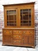 19TH CENTURY OAK GLAZED DRESSER, shallow cornice, square astragal glazed doors, fixed shelves, on