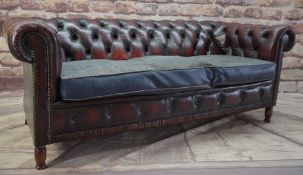 MAROON LEATHER CHESTERFIELD SOFA, with grey cloth over cushion, stained turned beech legs, 183 x