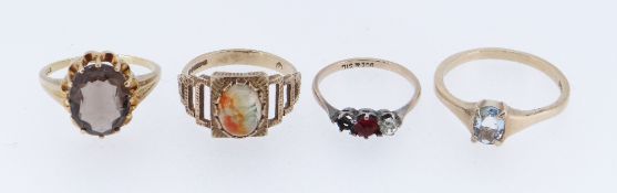 FOUR GOLD GEM SET RINGS comprising three 9ct gold rings and a 14ct gold ring, 11.1gms overall (4)