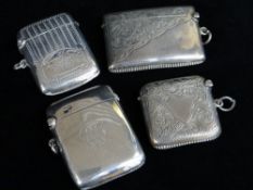 FOUR SIMILAR SILVER VESTA CASES, all of slightly curved form and having engraving of some kind