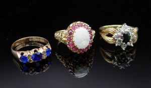 THREE 9CT GOLD RINGS comprising sapphire & diamond chip ring (size O), opal & ruby ring (size M),