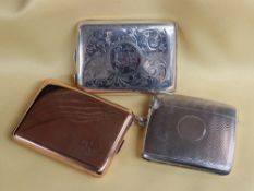 THREE VESTA / MATCH CASE HOLDERS comprising engine turned silver vesta case of curved form, silver