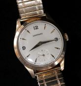 9CT GOLD GARRARD GENTS WRISTWATCH, the dial with pointed batons and Arabic numerals at 3, 9 and 12