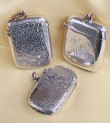 THREE SIMILAR SILVER VESTA CASES, of rectangular shape, all engraved, Birmingham and Chester