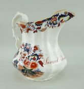 A LLANELLY SOUTH WALES POTTERY NAMED JUG of fluted form with twig handle, in transfer decorated in