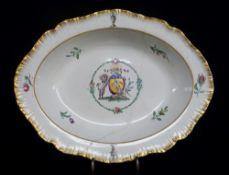 ARMORIAL DISH ATTRIBUTED TO SWANSEA EARTHENWARE with feathered edge and centred coat of arms in