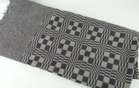 AN ANTIQUE WELSH NARROW LOOM COARSE WOOL BLANKET, in grey ground with tessellated design, 170 x