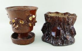 TWO BUCKLEY POTTERY PLANTERS the principle of pedestal form over drip-dish, both in brown glaze
