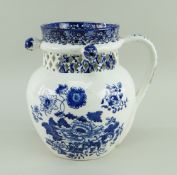 A SWANSEA CAMBRIAN PUZZLE JUG circa 1810, ovoid shape and loop handle, with cylindrical neck pierced