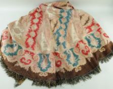 A VERY LARGE BELIEVED 19TH CENTURY WELSH PAISLEY SHAWL, of arched form with fine fringe, 310 x