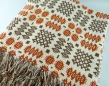 AN ANTIQUE TRADITIONAL WELSH BLANKET, in mustard ground with repeat bands of iron red and brown