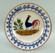 LLANELLY POTTERY COCKEREL PLATE, continuous sponged arrowpoint border, 25cms diam Provenance: