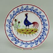 LLANELLY POTTERY COCKEREL PLATE, continuous sponged arrowpoint border, 20cms diam Provenance: