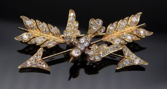VICTORIAN DIAMOND ENCRUSTED DOVE & CROSSED ARROWS BROOCH, yellow metal, the dove set with ruby eyes,
