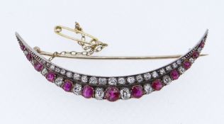 FINE DIAMOND & RUBY ENCRUSTED CRESCENT BROOCH, the forty-eight graduated stones set in yellow and