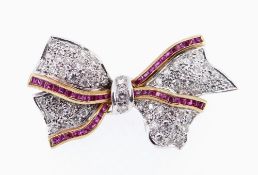 18CT WHITE GOLD DIAMOND & RUBY BAR BROOCH, of bow design with border of rubies, 4.2cms wide, 11.
