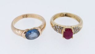 YELLOW METAL RINGS, including blue sapphire and pink gem stone, both engraved 'K18', ring size O and