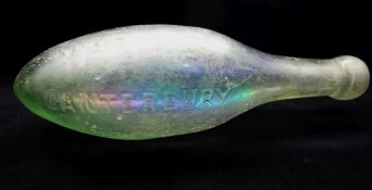 MID-VICTORIAN GREEN GLASS HAMILTON BOTTLE, embossed 'Lent by M.A.Robins, Canterbury', 24cms long