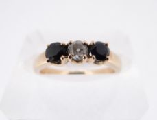 YELLOW METAL THREE STONE DIAMOND & SAPPHIRE RING, engraved 'K18', ring size M, 3.4gms