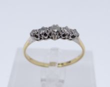 18CT GOLD & PLATINUM FIVE STONE DIAMOND RING, ring size U, 2.7gms