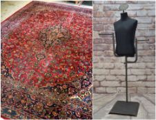 KASHAN-STYLE CARPET, with central medallion suspending pendants, on a red field of scrolling