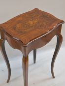 VICTORIAN WALNUT MARQUETRY WORK TABLE IN THE FRENCH TASTE, shaped inlaid top containing paper-