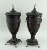 PAIR GEORGIAN-STYLE TURNED WOOD URNS & COVERS, foliate carved borders, brass urn finials, lion's