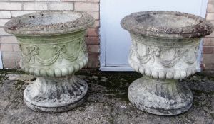PAIR OF LARGE RECONSTITUTED STONE GARDEN URNS, moulded ribbon-tied swags to frieze, above fluted