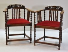 PAIR EARLY 20TH CENTURY OAK ARMCHAIRS, with leaf carved crestings, barley twist/bobbin uprights, and