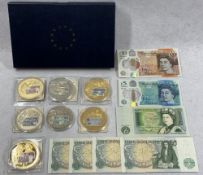 BRITISH BANK NOTE COMMEMORATIVE COINS with a quantity of banknotes, seven coins with denominations
