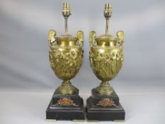 GILDED BRONZE URN TABLE LAMPS, A PAIR, on polished slate bases