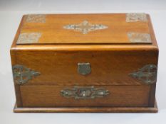 ANTIQUE OAK DESK CABINET with plated embossed detail, 17cms tall, 30 x 18cms