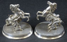 SILVERED MARLEY HORSES WITH ATTENDANTS, A PAIR - on oval bases, 22cms H, 18cms L