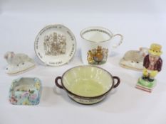 A POWELLS OF BUCKLEY TWIN-HANDLED CIRCULAR BUTTER DISH, a pair of Staffordshire pottery reclining