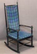 SPINDLE BACK EBONISED ROCKING ARMCHAIR CIRCA 1900 with tartan upholstered seat and loose back pad,