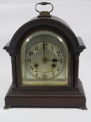 BRACKET CLOCK with silvered dial on brass feet, 31cms H, 18cms W, 17cms D