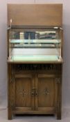 JAYCEE OAK COCKTAIL CABINET with carved and linenfold detail, lift top drop down front with mirrored