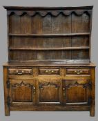 GEORGE III MID WALES OAK DRESSER CIRCA 1760 & LATER having a three shelf upper rack with shaped