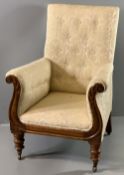 VICTORIAN CLASSICAL STYLE BUTTON UPHOLSTERED ARMCHAIR with curled carved detail in mahogany to the