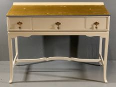 WHITE PAINTED THREE DRAWER DRESSING TABLE with shaped apron and stretcher, 80cms H, 107cms W,